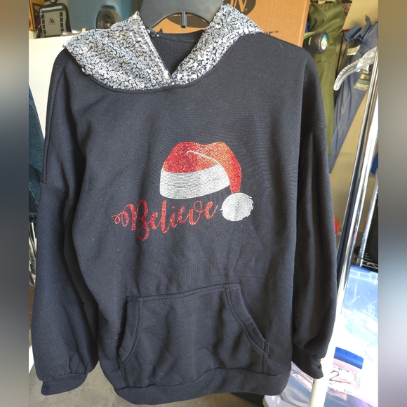 Black 'Believe' Hoodie with Santa Hat Design - Picture 1 of 5